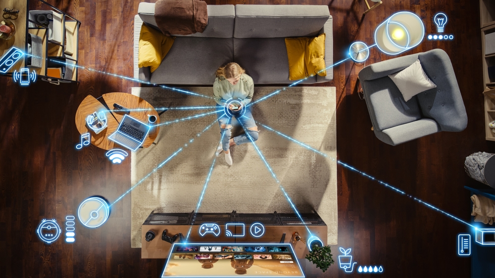 Woman connecting IoT devices in her home.